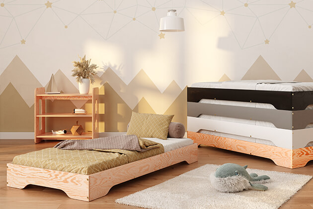 Stos drewnianych łóżek w kolorach czarnym, szarym, białym i lakierowanego drewna oraz pojedyncze łóżko w kolorze naturalnym